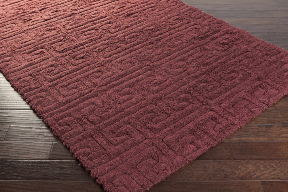 Maroon geometric hand-woven wool area rug with textured low-pile weave