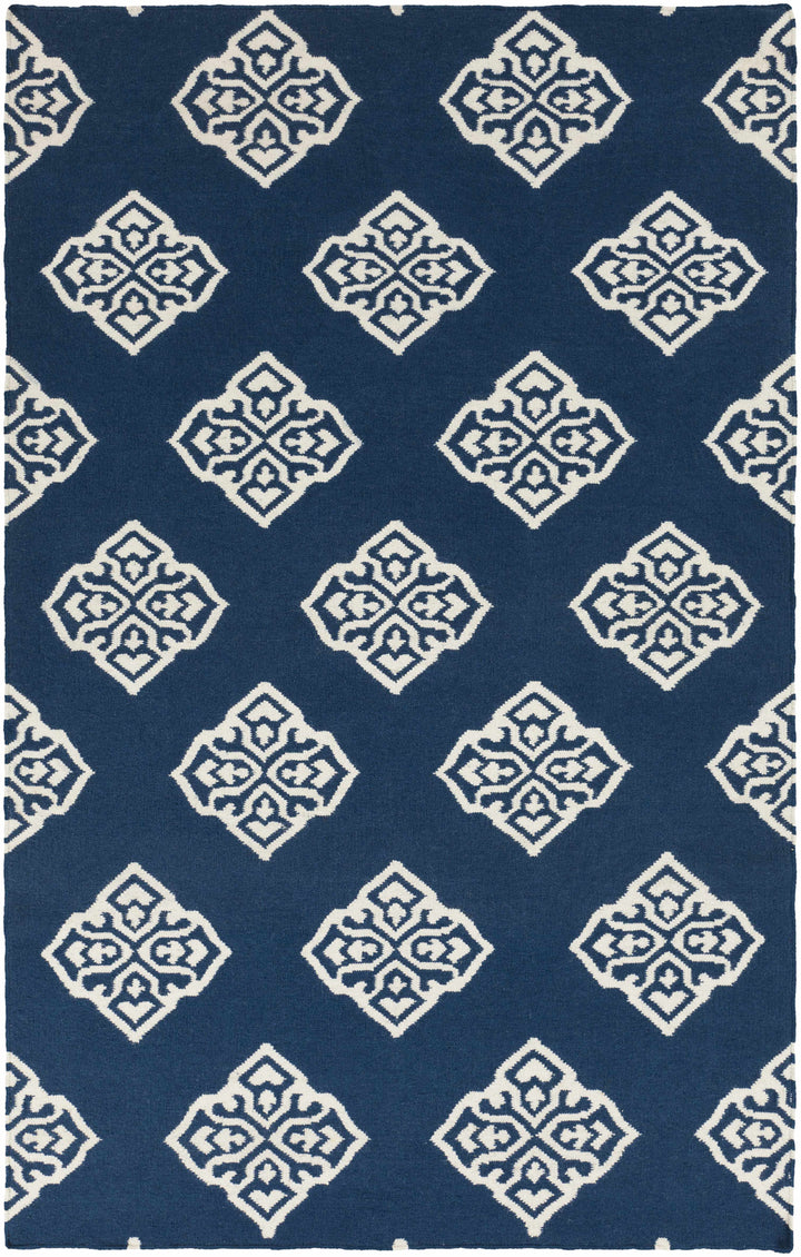 Blue hand-woven area rug with repeating ivory diamond medallion pattern