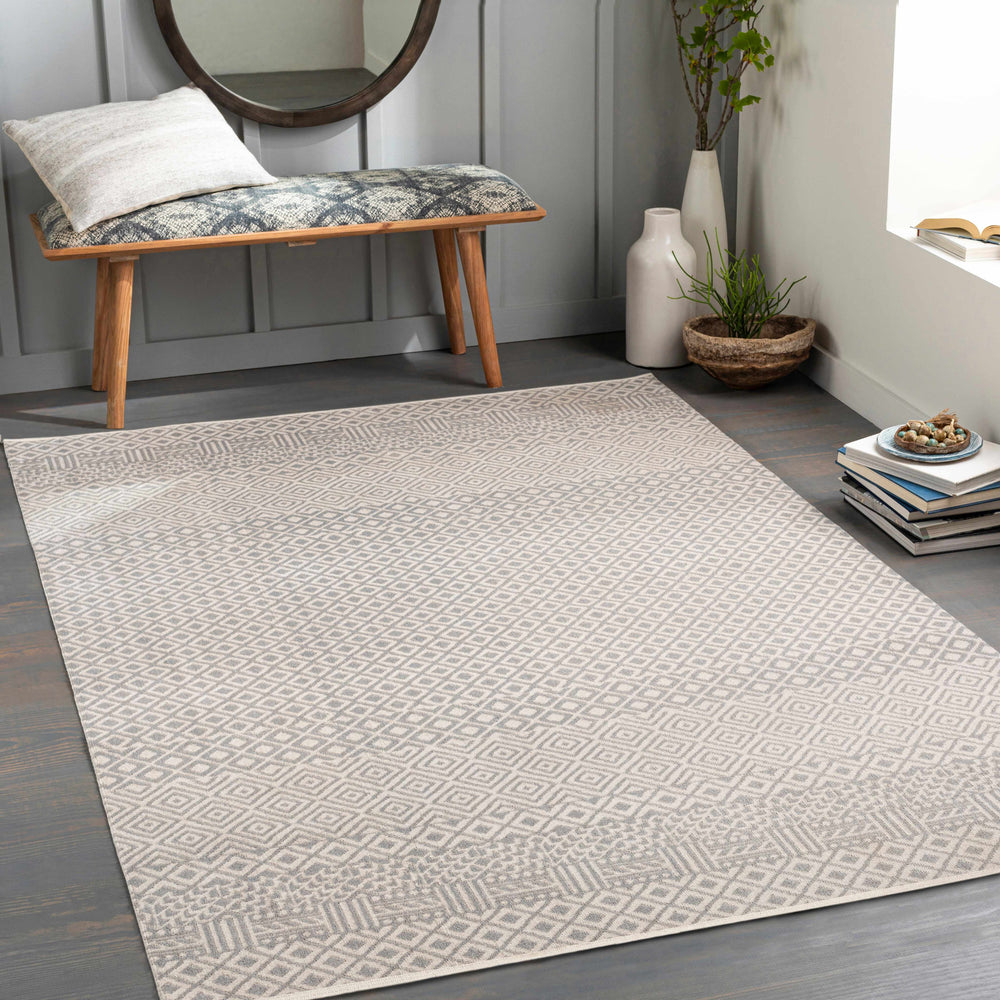 Ivory geometric area rug in room, featuring diamond lattice pattern