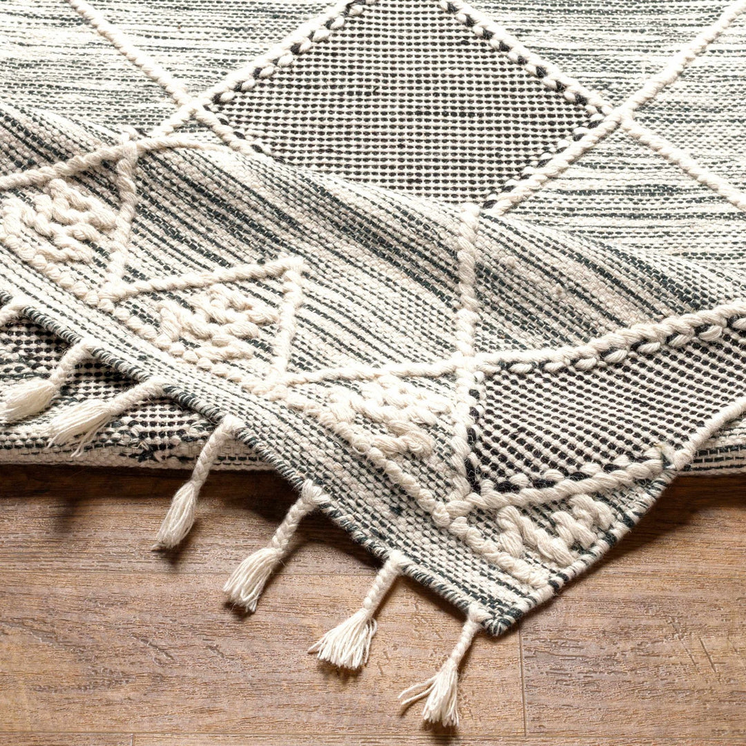 Mabua Tasseled Modern Black Hand Woven Jute & Wool Rug - The Rug Decor
