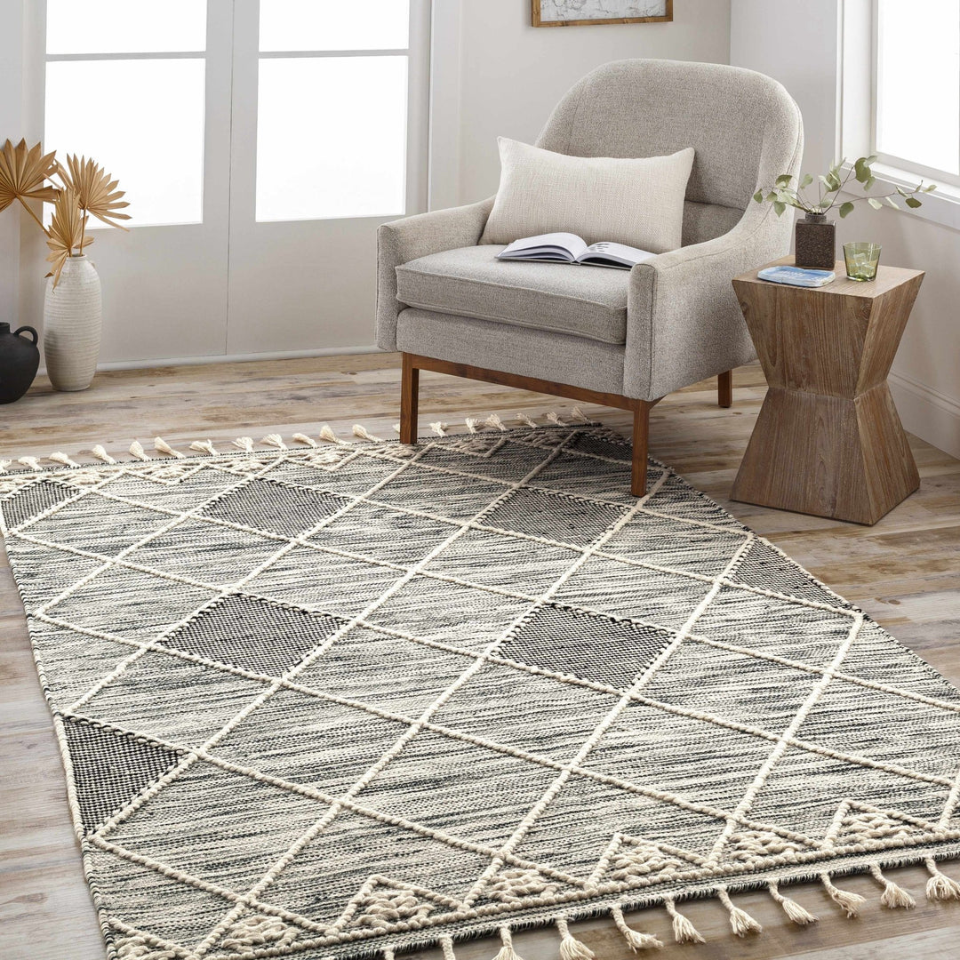Mabua Tasseled Modern Black Hand Woven Jute & Wool Rug - The Rug Decor