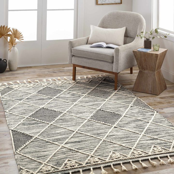 Mabua Tasseled Modern Black Hand Woven Jute & Wool Rug - The Rug Decor