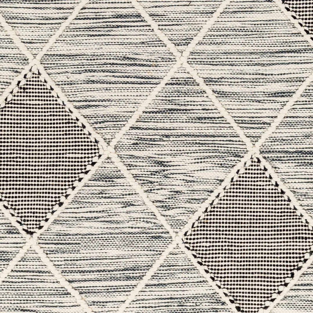 Mabua Tasseled Modern Black Hand Woven Jute & Wool Rug - The Rug Decor