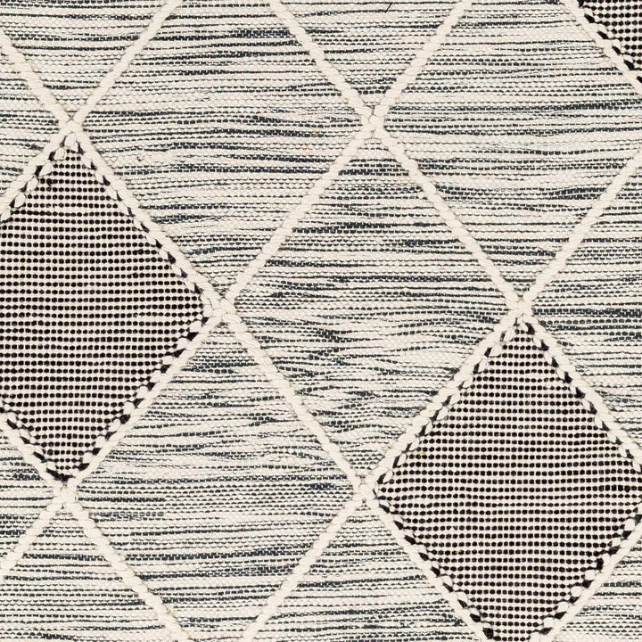 Mabua Tasseled Modern Black Hand Woven Jute & Wool Rug - The Rug Decor