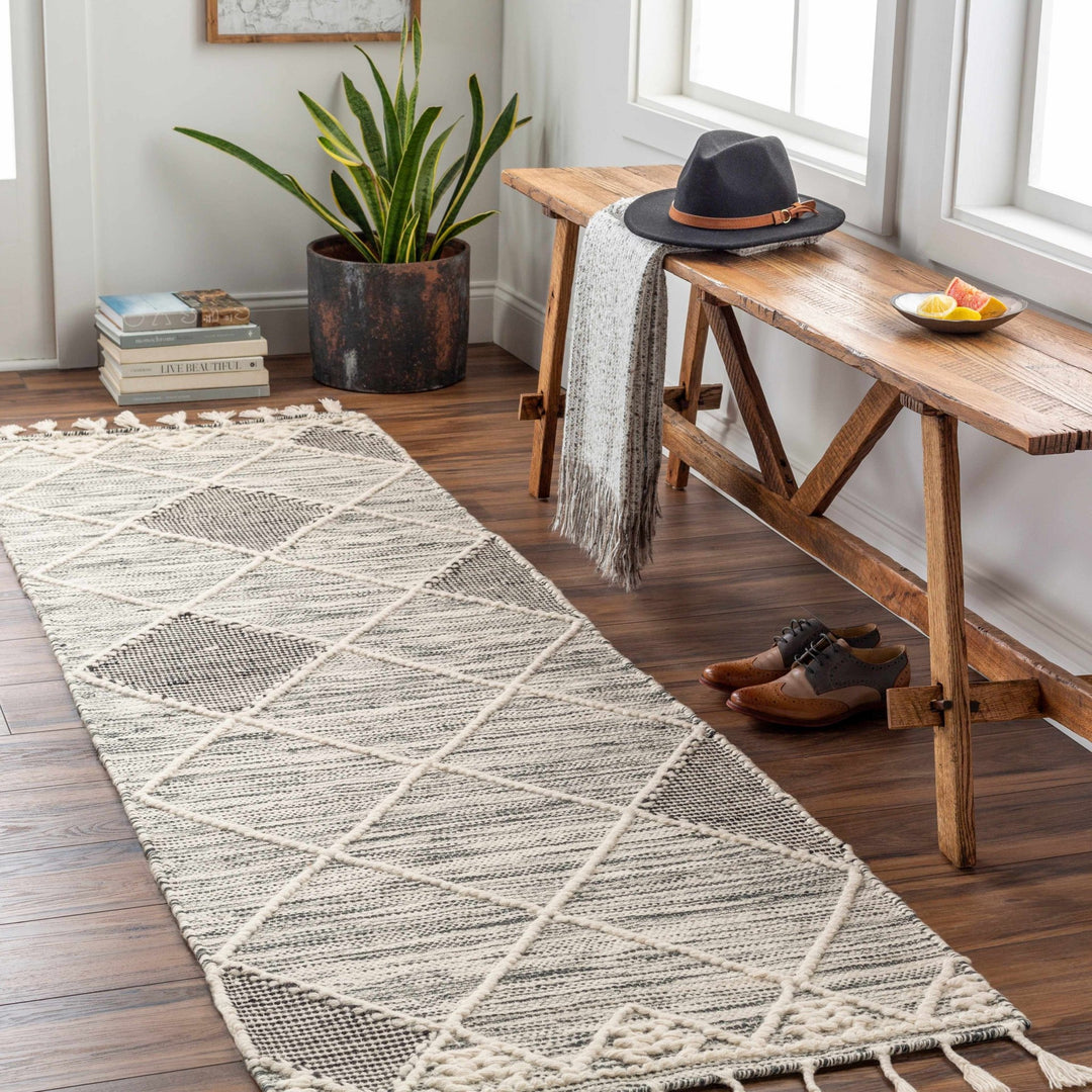 Mabua Tasseled Modern Black Hand Woven Jute & Wool Rug - The Rug Decor