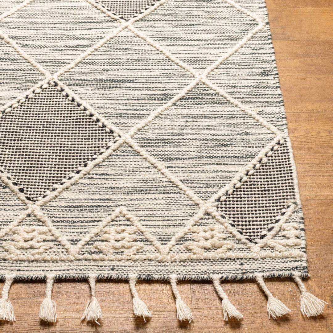Mabua Tasseled Modern Black Hand Woven Jute & Wool Rug - The Rug Decor
