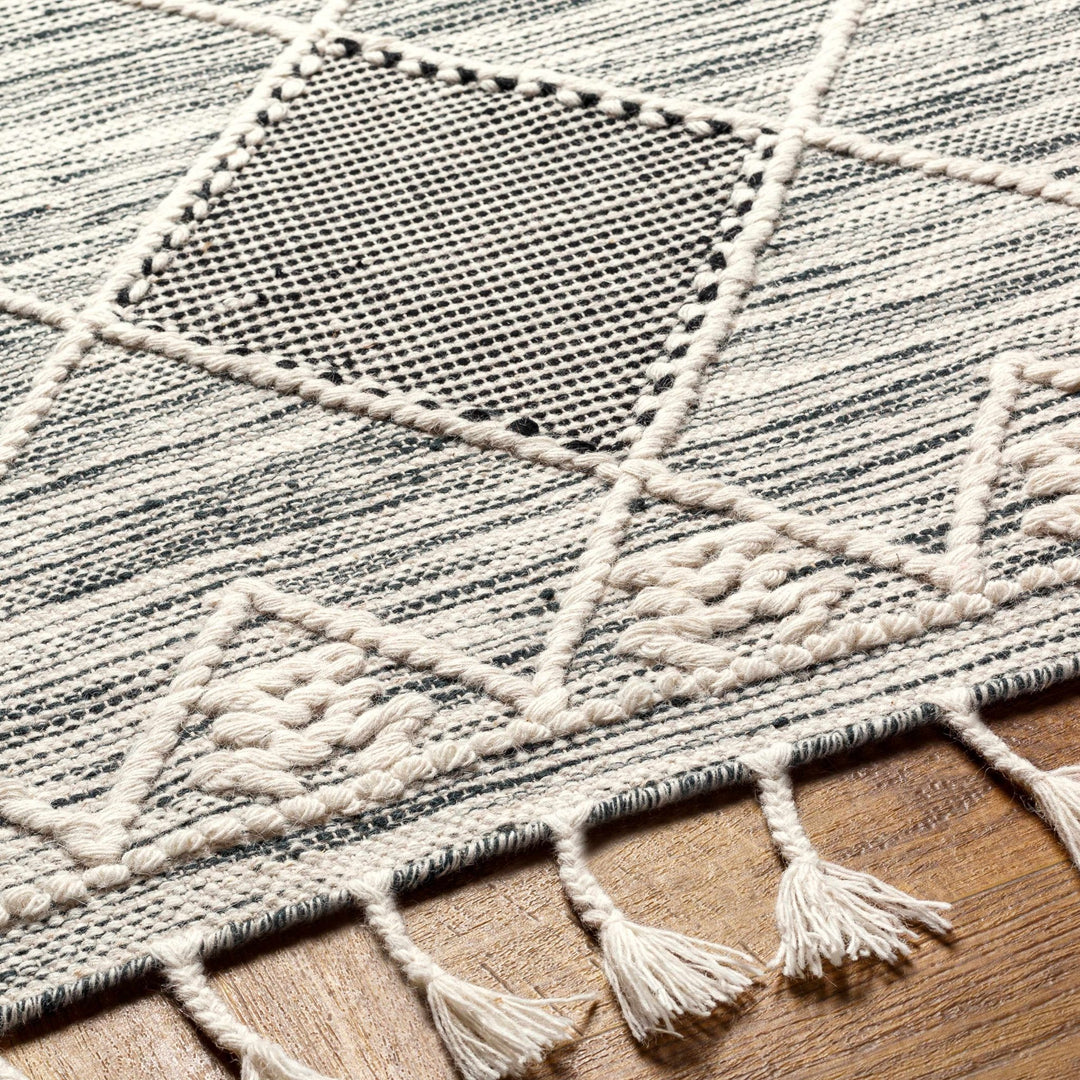 Mabua Tasseled Modern Black Hand Woven Jute & Wool Rug - The Rug Decor