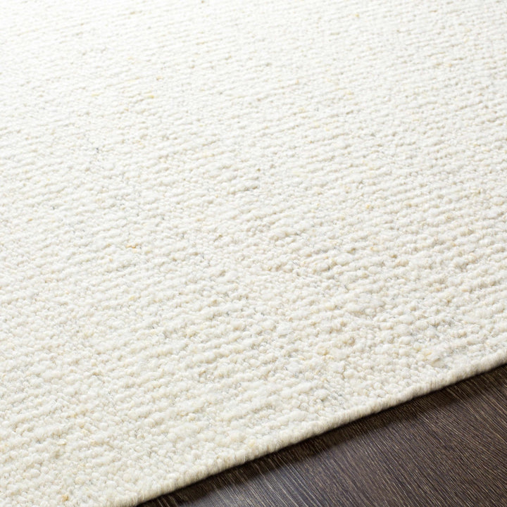 Manicahan Contemporary Solid Ivory And Cream Wool Rug - The Rug Decor