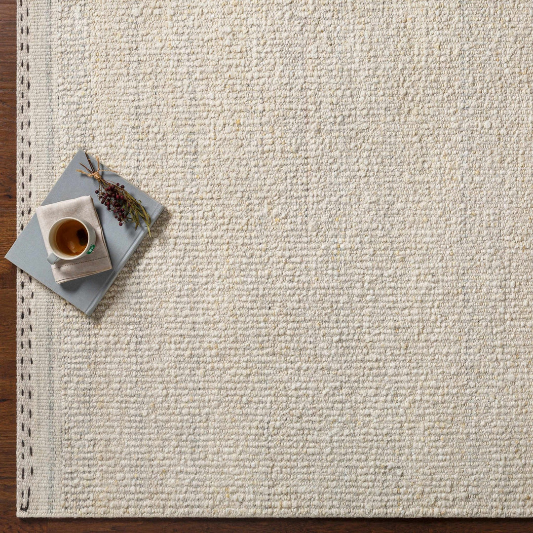 Manicahan Contemporary Solid Ivory And Cream Wool Rug - The Rug Decor
