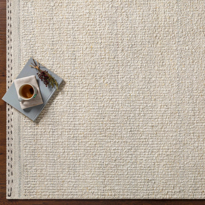 Manicahan Contemporary Solid Ivory And Cream Wool Rug - The Rug Decor