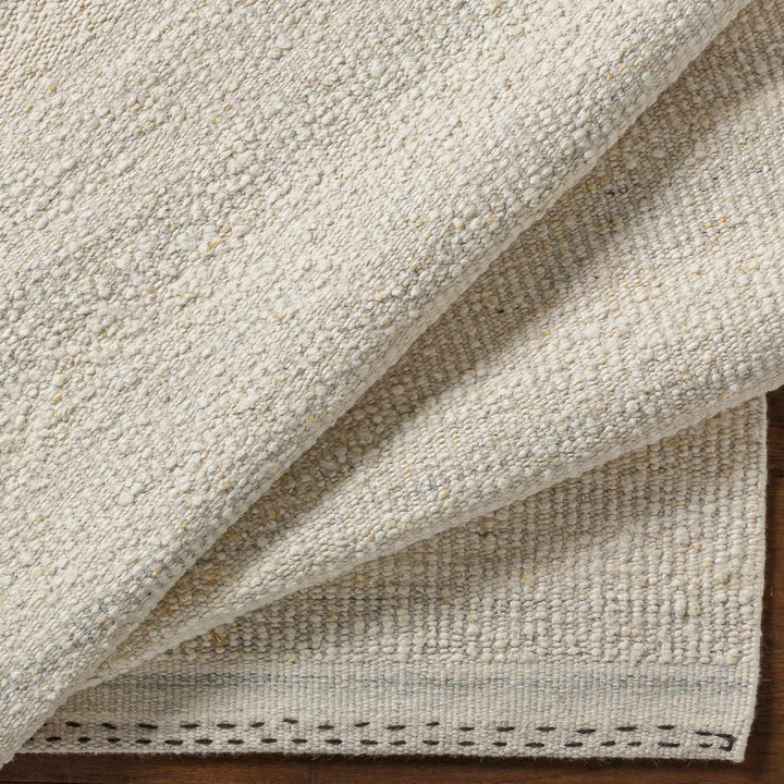 Manicahan Contemporary Solid Ivory And Cream Wool Rug - The Rug Decor