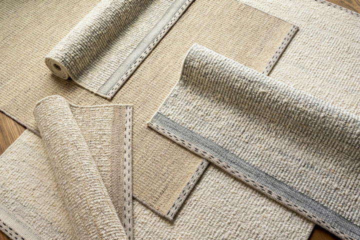 Manicahan Contemporary Solid Ivory And Cream Wool Rug - The Rug Decor