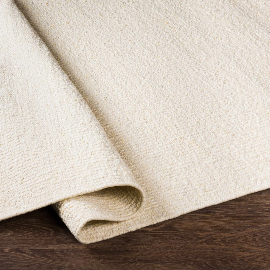 Manicahan Contemporary Solid Ivory And Cream Wool Rug - The Rug Decor
