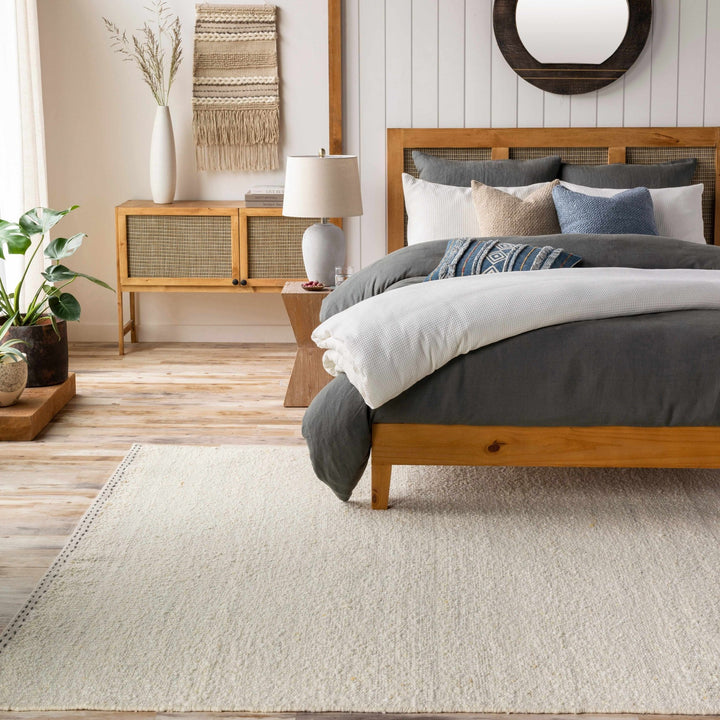 Manicahan Contemporary Solid Ivory And Cream Wool Rug - The Rug Decor