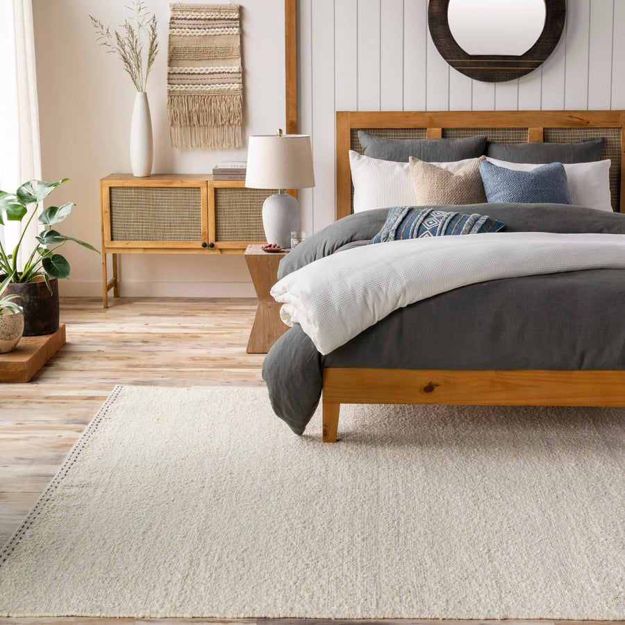 Manicahan Contemporary Solid Ivory And Cream Wool Rug - The Rug Decor
