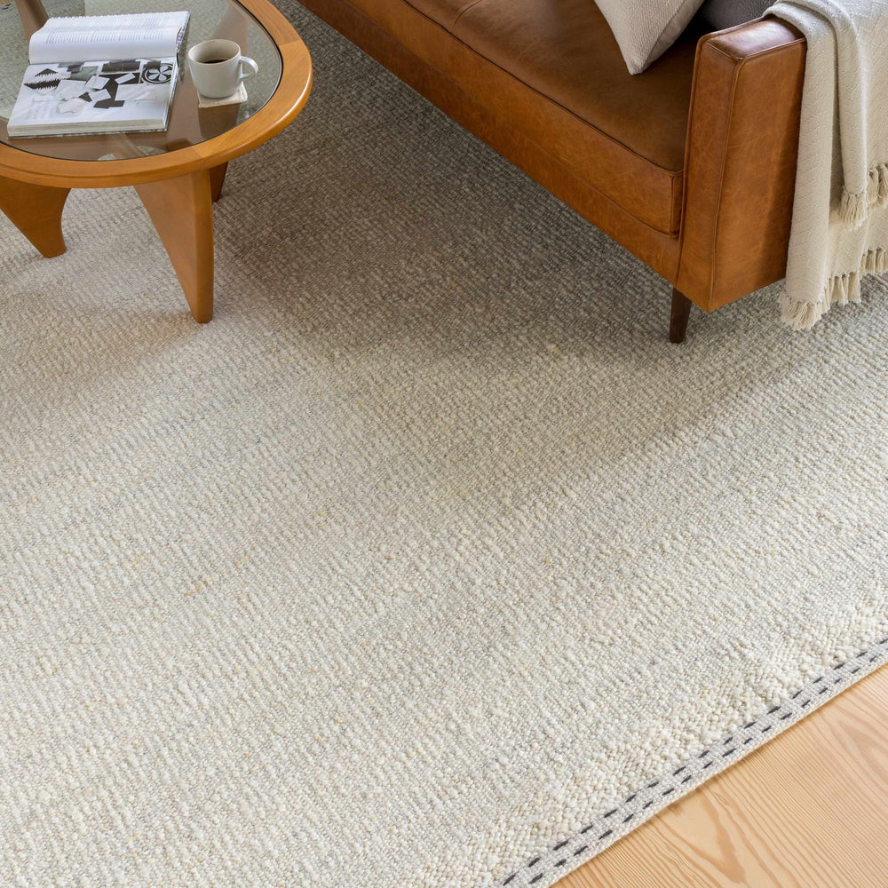 Manicahan Contemporary Solid Ivory And Cream Wool Rug - The Rug Decor