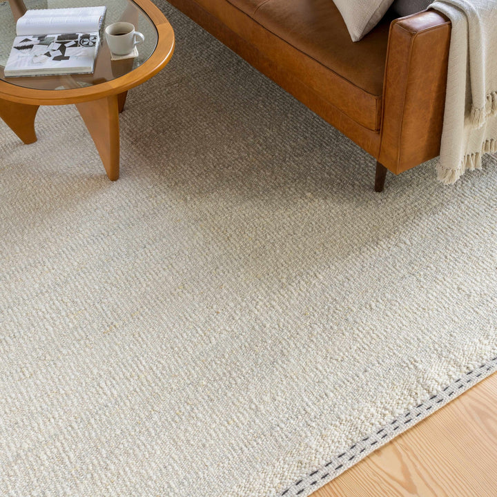 Manicahan Contemporary Solid Ivory And Cream Wool Rug - The Rug Decor