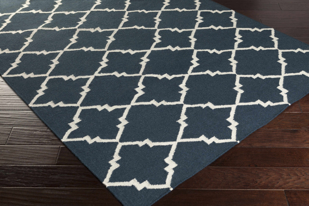 Blue and ivory geometric area rug corner view with trellis lattice pattern