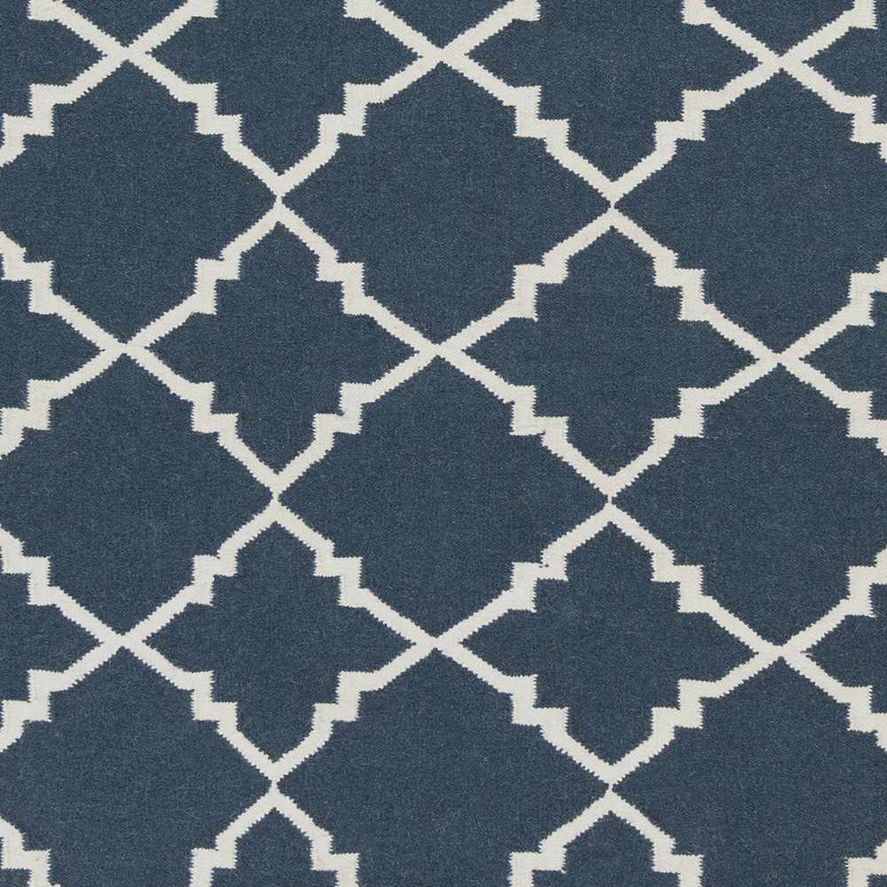 Close-up of blue and ivory geometric trellis pattern on area rug