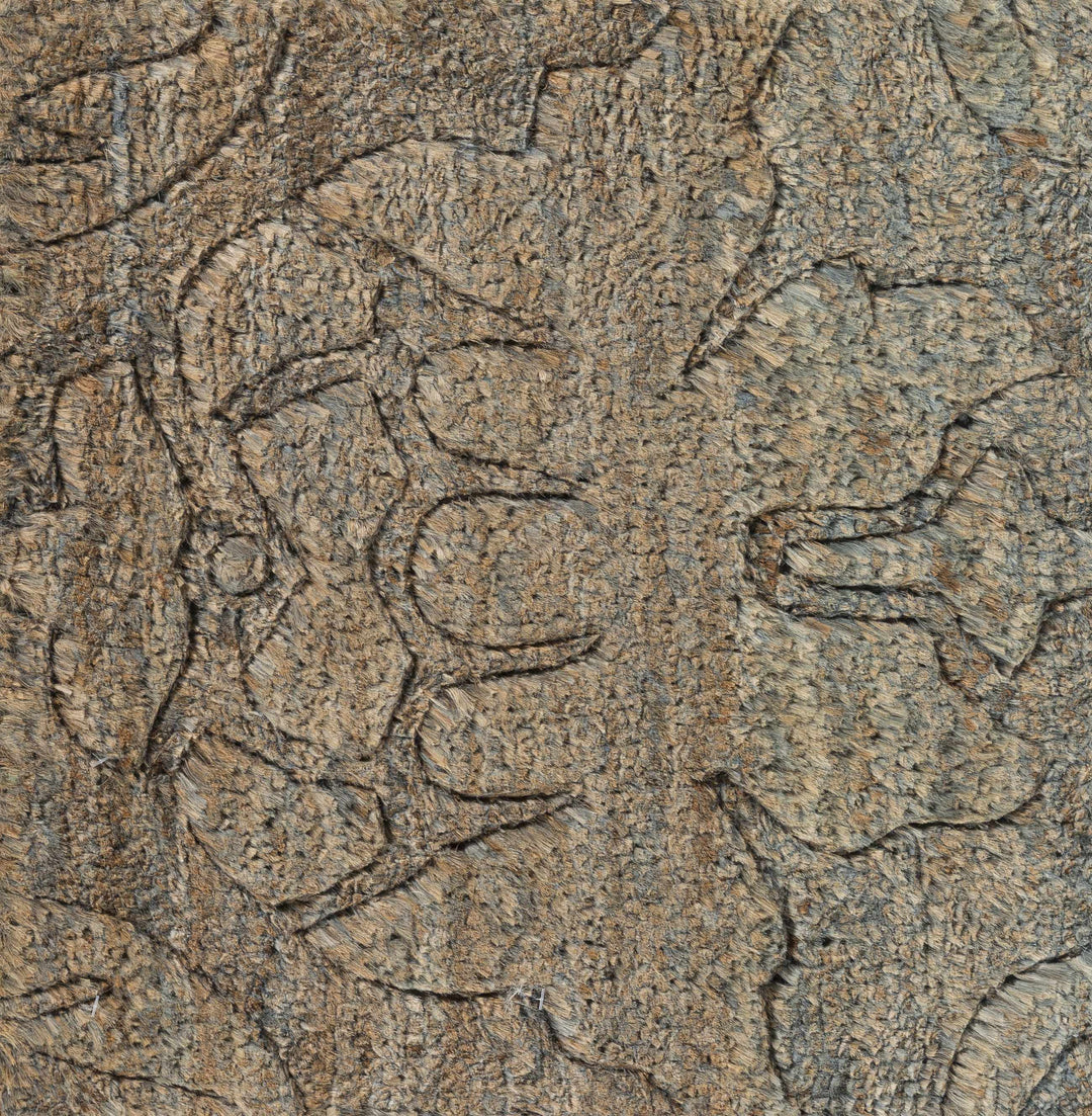 Close-up detail of brown jute rug texture with abstract hand-knotted lines