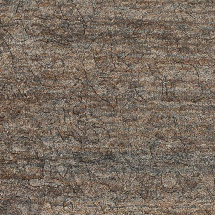 Close-up of brown jute rug showing abstract hand-knotted texture and lines
