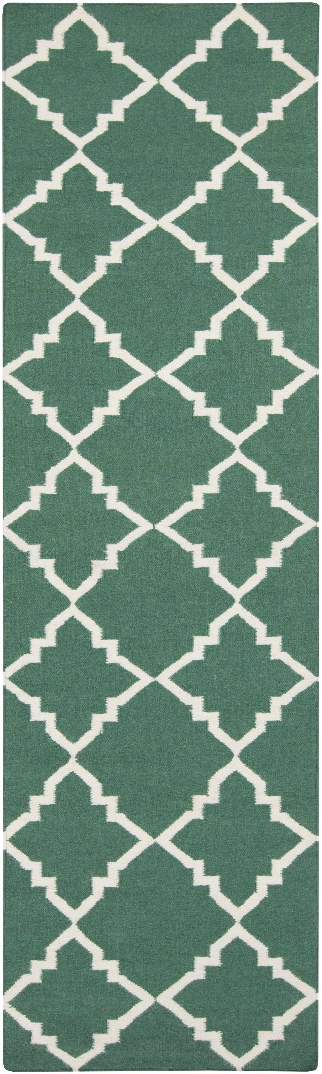 Hand-woven green area rug with tall white geometric lattice trellis pattern