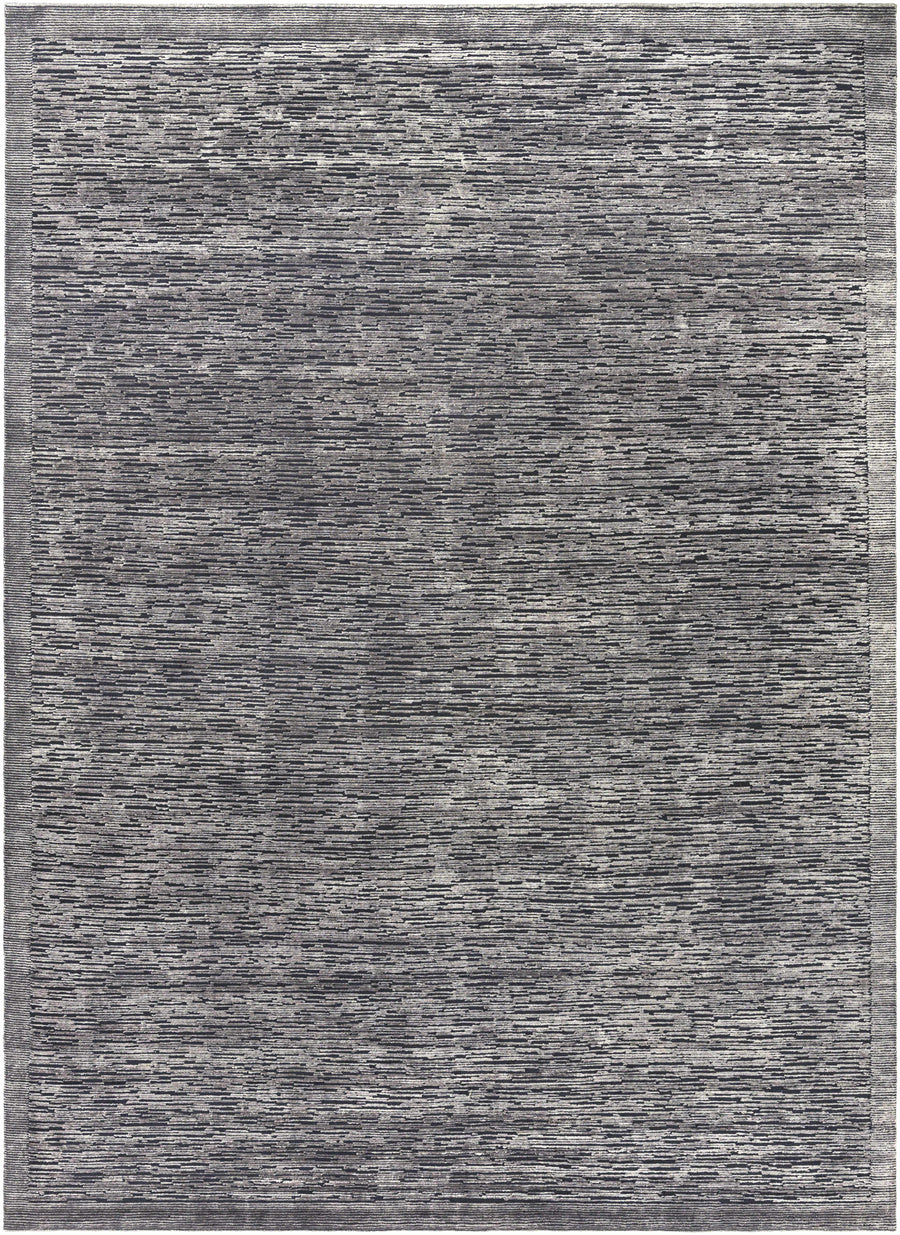 Charcoal gray hand-knotted area rug with dense textured pattern and border.