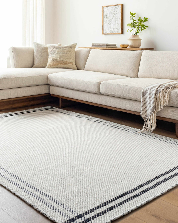 Nimue Ivory & Blue Bordered Hand Woven Wool Rug - The Rug Decor