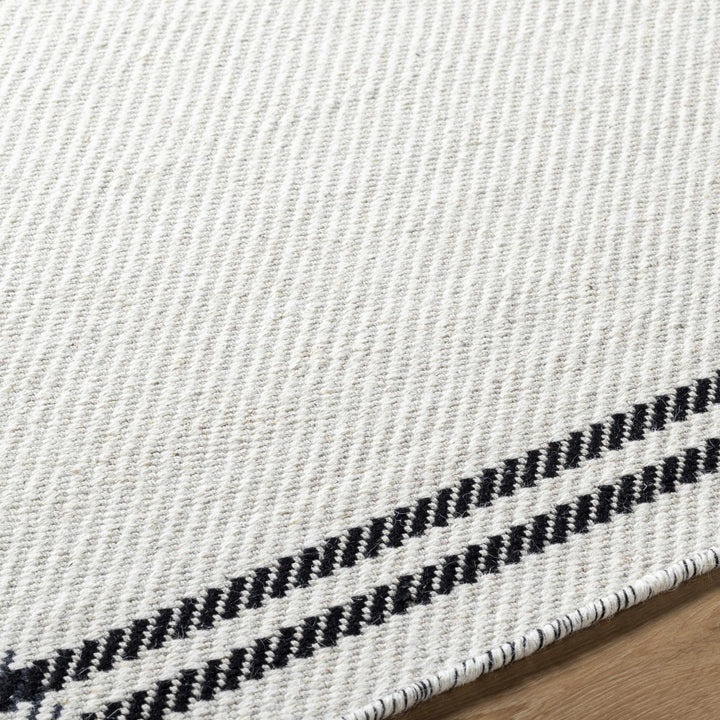 Nimue Ivory & Blue Bordered Hand Woven Wool Rug - The Rug Decor
