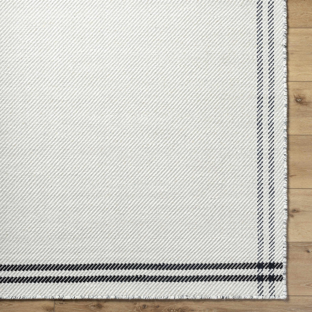 Nimue Ivory & Blue Bordered Hand Woven Wool Rug - The Rug Decor