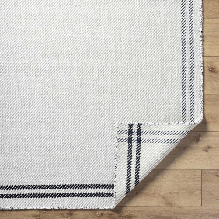 Nimue Ivory & Blue Bordered Hand Woven Wool Rug - The Rug Decor
