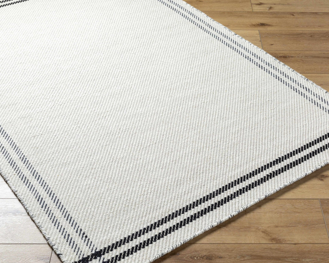 Nimue Ivory & Blue Bordered Hand Woven Wool Rug - The Rug Decor