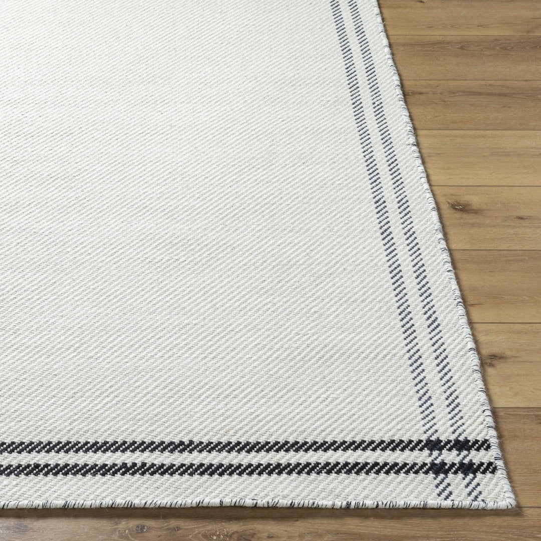 Nimue Ivory & Blue Bordered Hand Woven Wool Rug - The Rug Decor