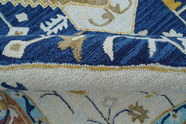 Ollie Traditional Blue And Ivory Hand Tufted Wool Rug - The Rug Decor