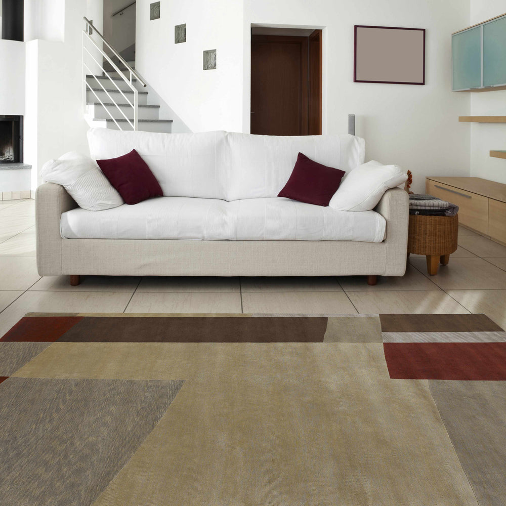 Abstract hand-knotted wool area rug with beige, brown, burgundy, and cream geometric blocks