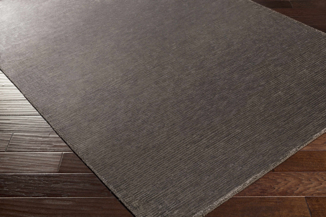 Taupe solid area rug, modern rectangle with visible woven edge