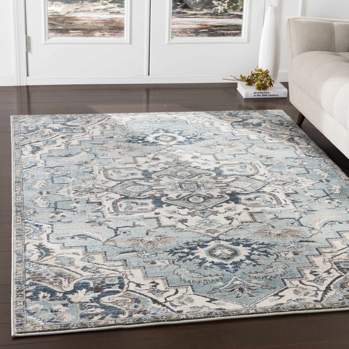 Pukwana Traditional Style Blue And Ivory Area Rug