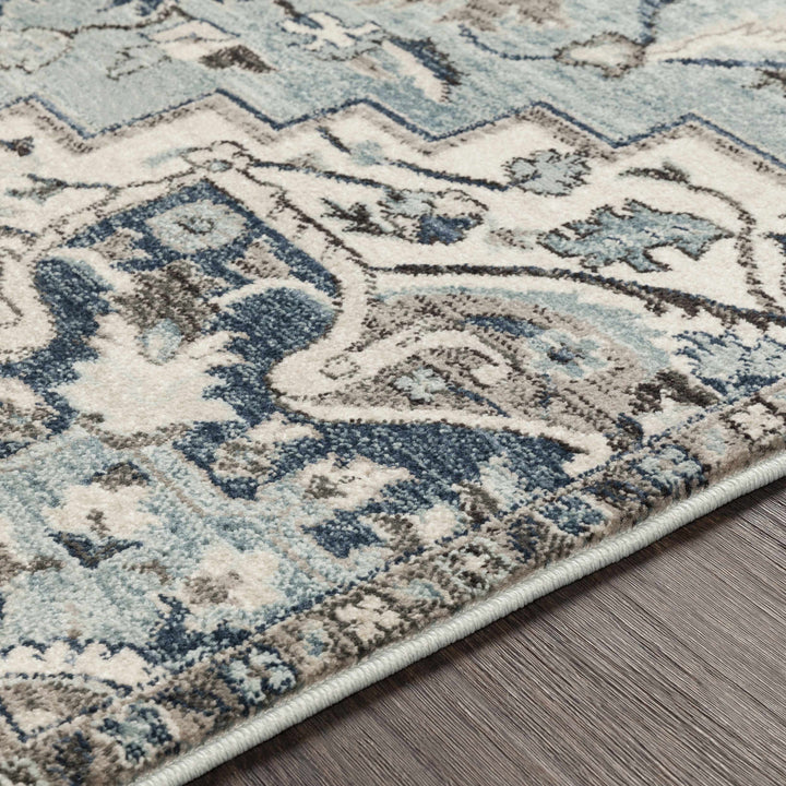 Pukwana Traditional Style Blue And Ivory Area Rug