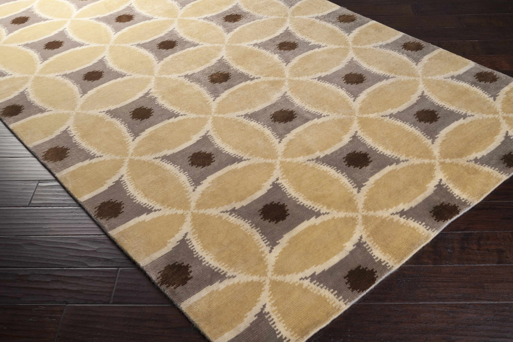Beige geometric wool area rug with repeating ovals and brown square accents
