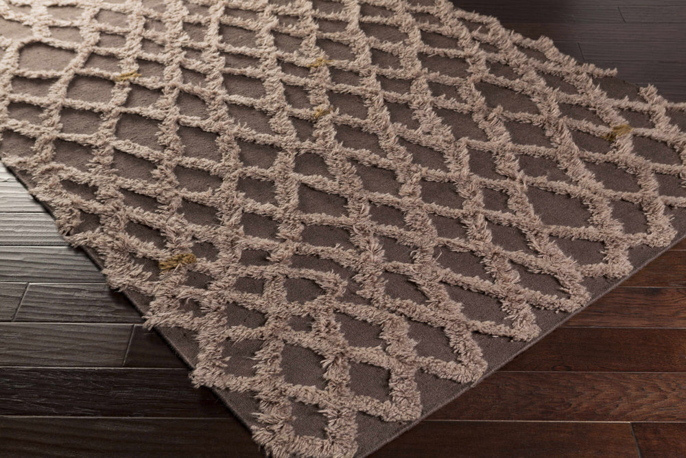 Taupe wool area rug with raised interlocking lattice pattern, angled view