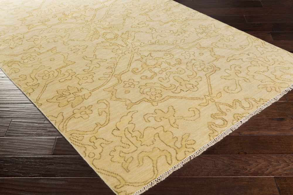 Beige and tan traditional area rug corner with ornate floral medallion-style design