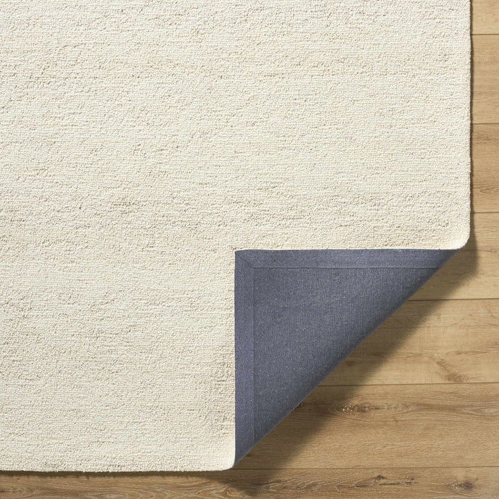 Sevan Modern Solid Design Ivory Hand Tufted Wool Rug - The Rug Decor