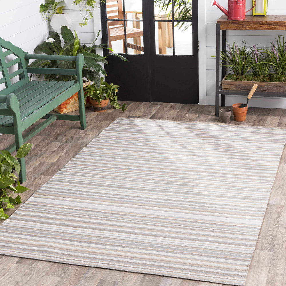 Ivory outdoor area rug with thin horizontal brown and gray stripes