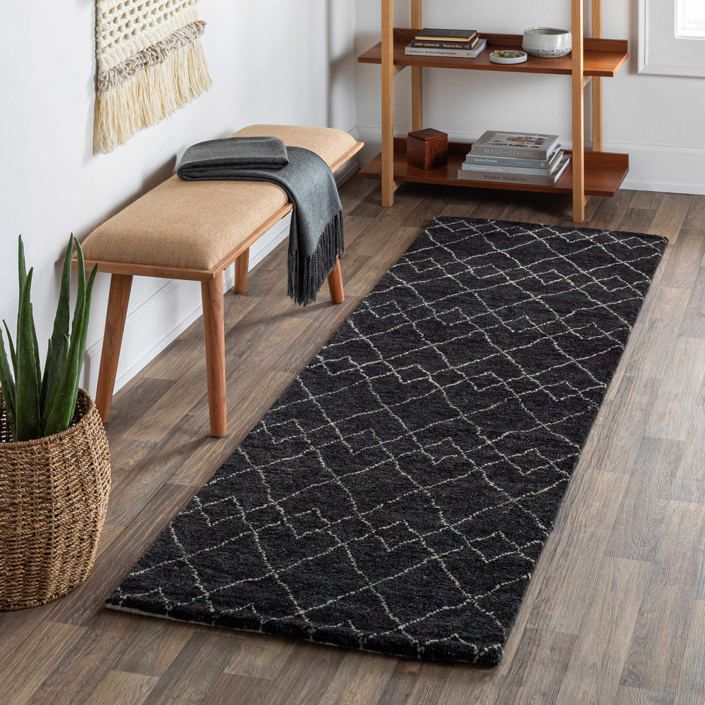 Charcoal rug with diamond lattice geometric pattern in neutral light lines