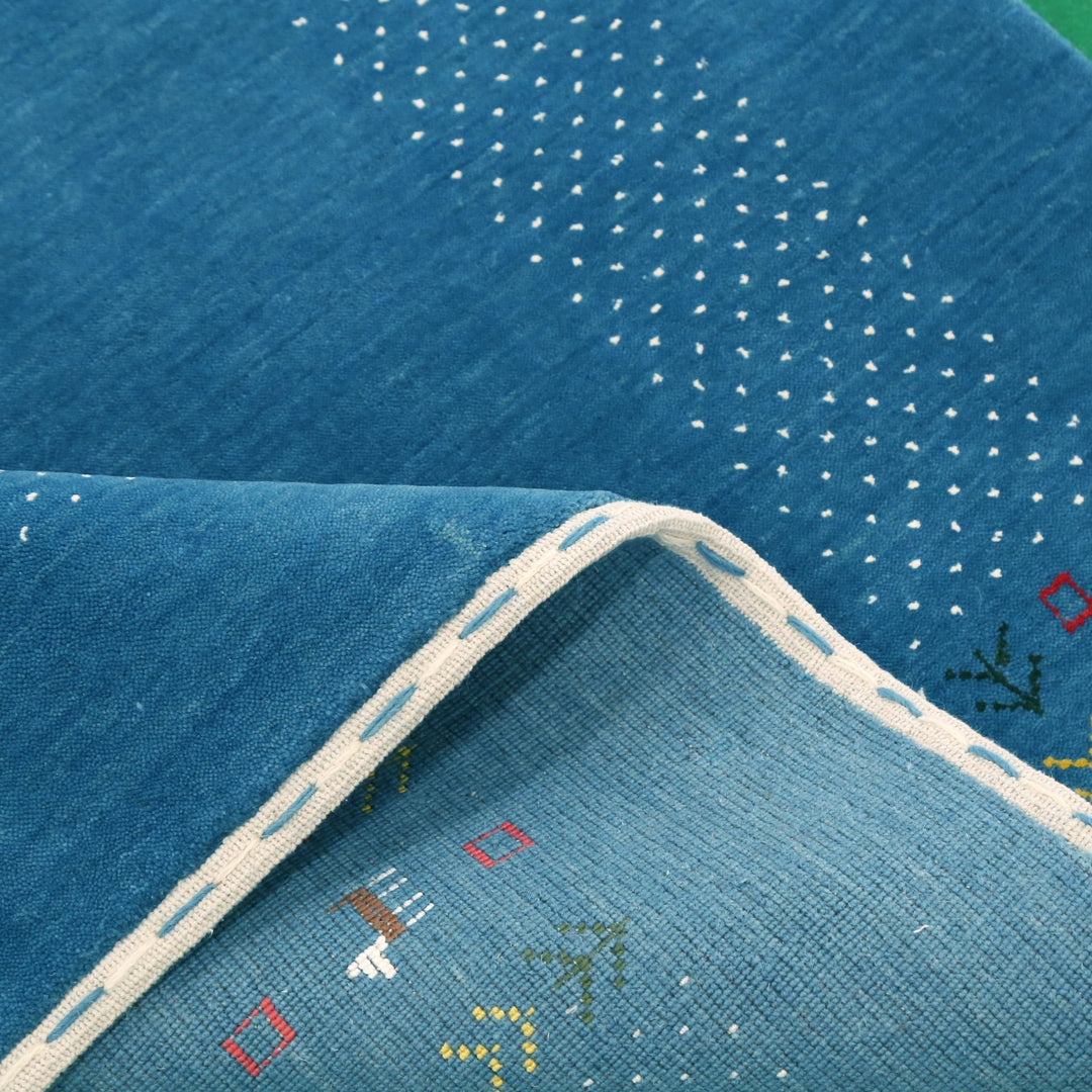 Solid Blue Border Design Hand Loomed Wool Area Rug - The Rug Decor