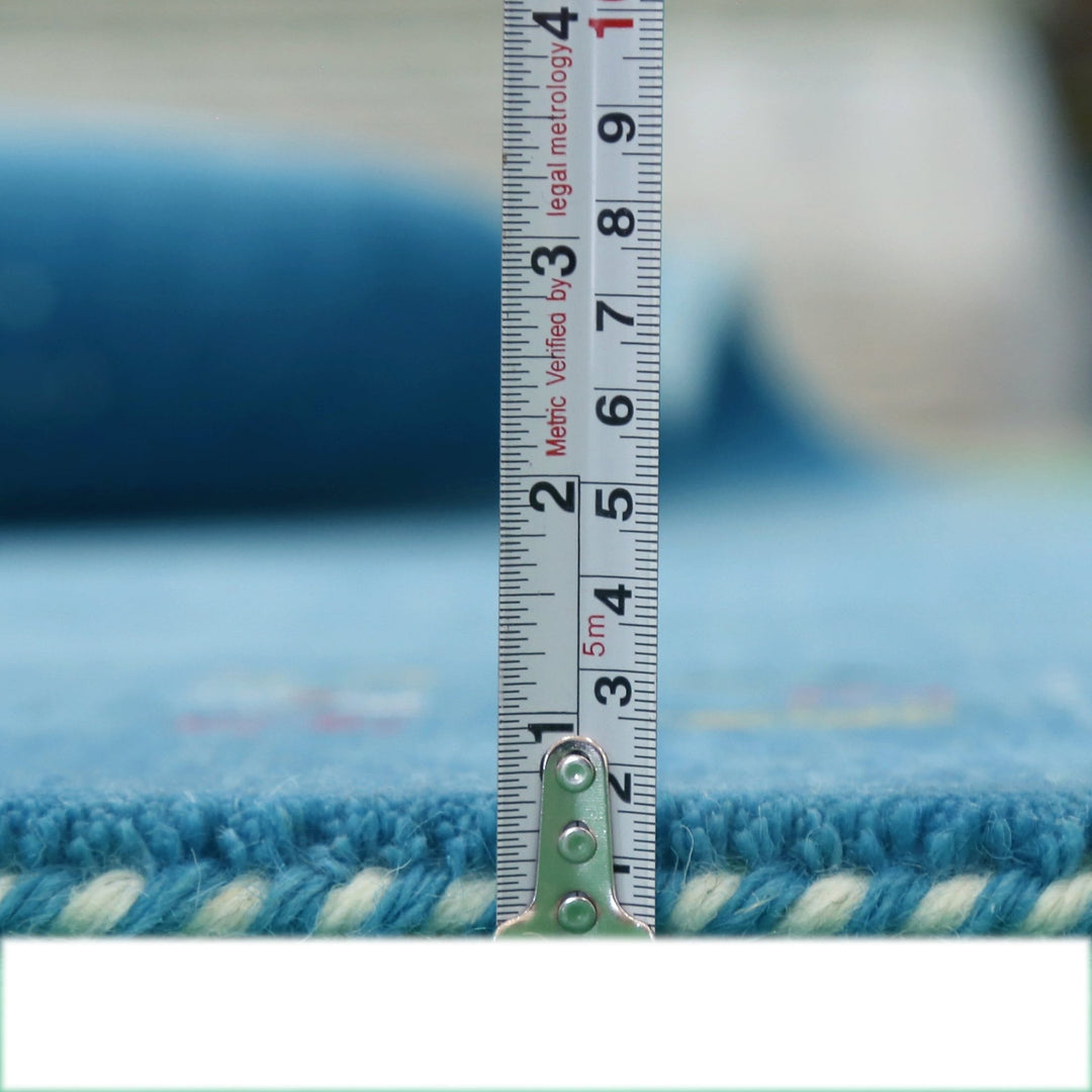 Solid Blue Border Design Hand Loomed Wool Area Rug - The Rug Decor