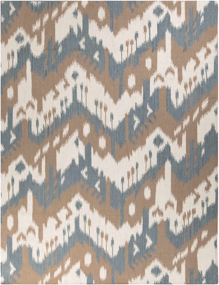 Rectangular area rug featuring cream, blue, beige, and brown geometric pattern