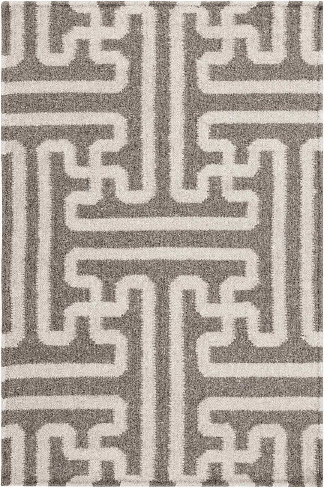 Gray and ivory geometric Greek-key rug, symmetrical central medallion close-up