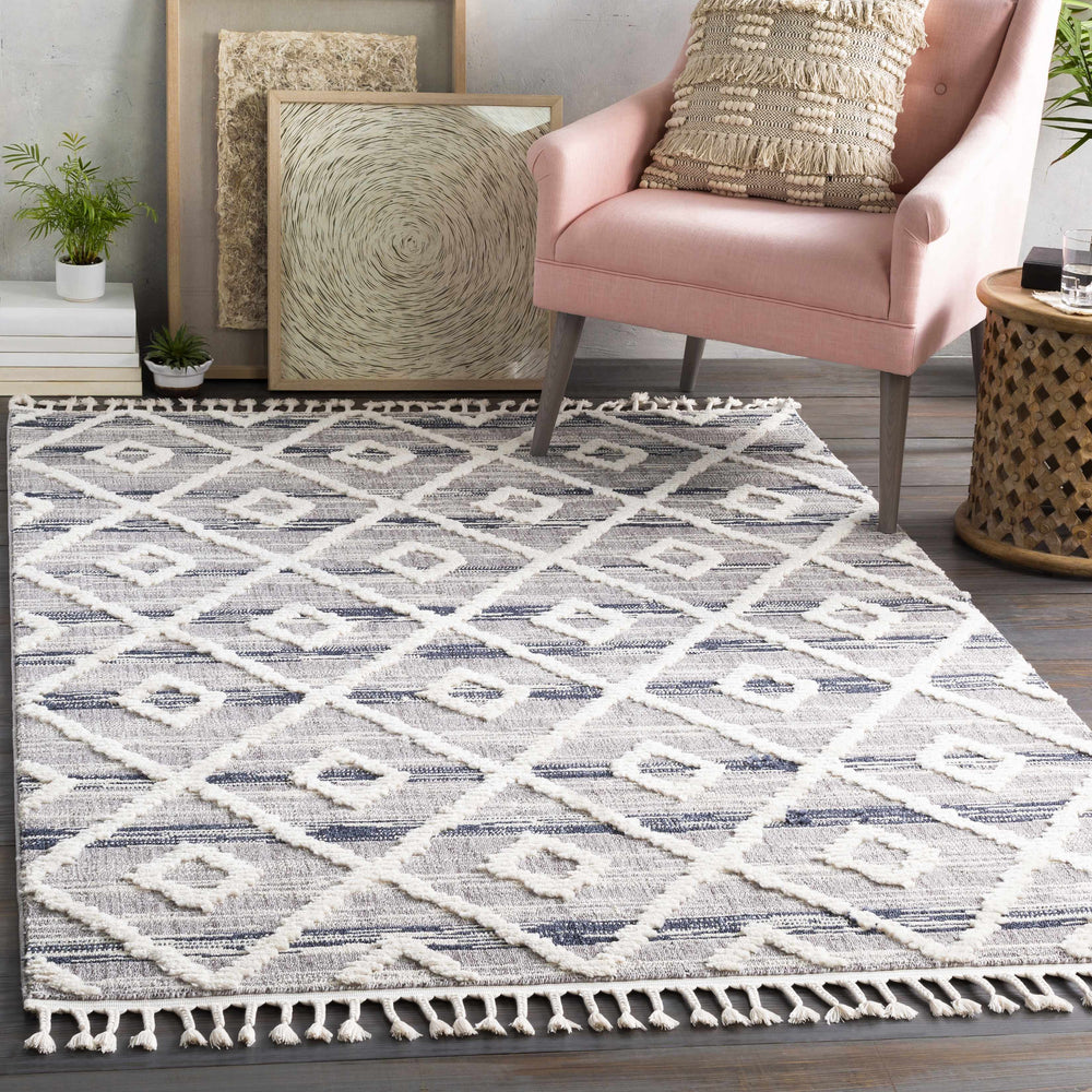 Ivory and gray geometric area rug with diamond and X motifs, short fringe edge.