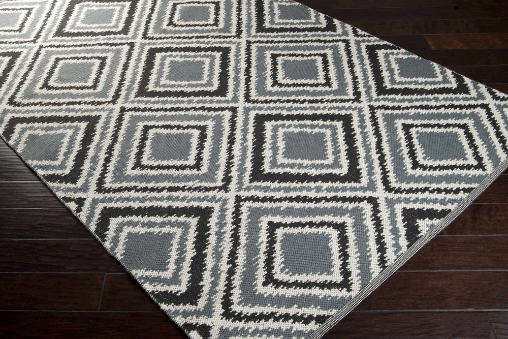 Gray hand-woven wool area rug with diamond motif and zigzag pattern